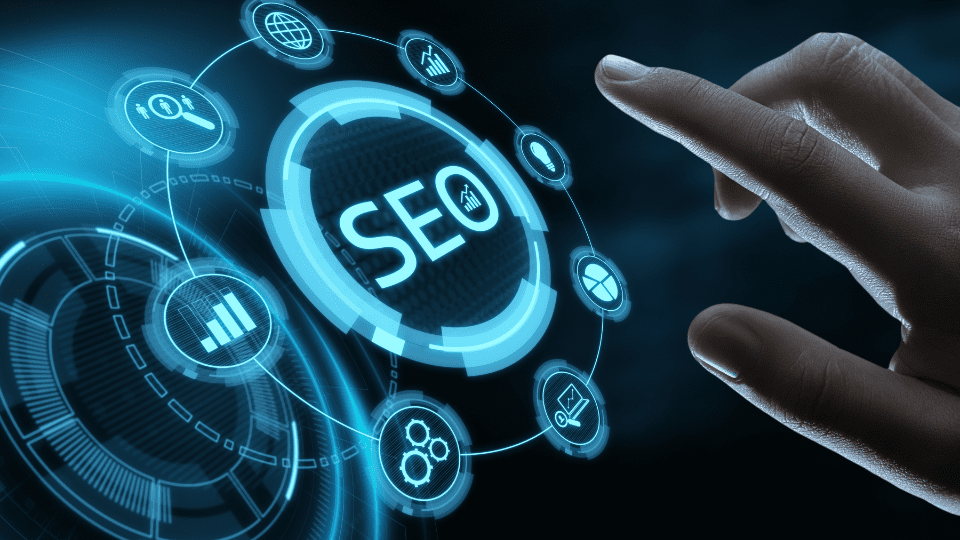 A hand touching a digital interface displaying various SEO-related icons, with the central focus on the 'SEO' icon surrounded by graphs, charts, and other data symbols.