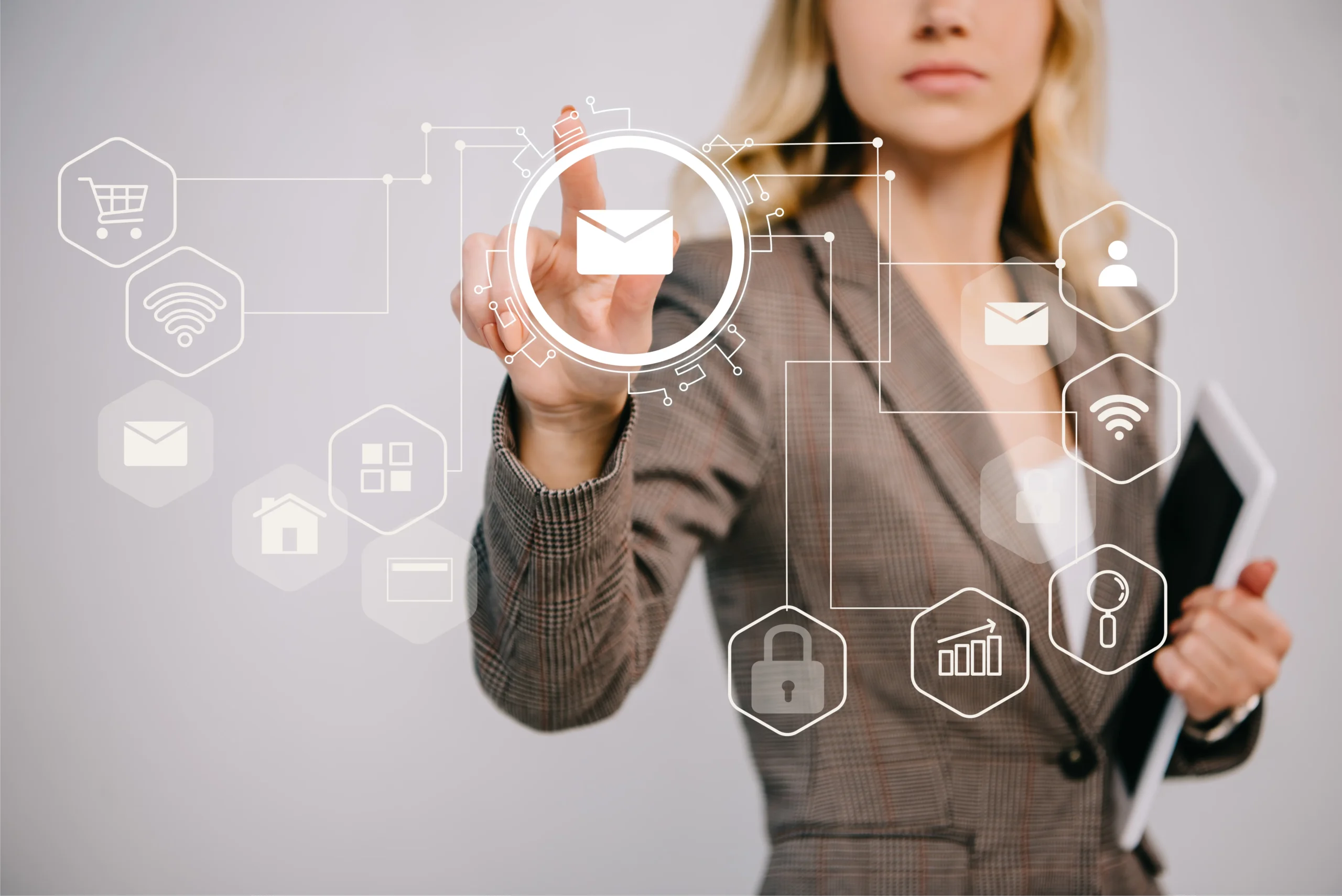 A businesswoman interacting with a digital interface, highlighting various icons related to communication, security, and online services such as email, shopping, wifi, and analytics.